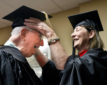 Gus Stuhldreher turning his tassel after receiving his degree.  Photo Courtesy of Paul Tople/Akron Beacon Journal.
