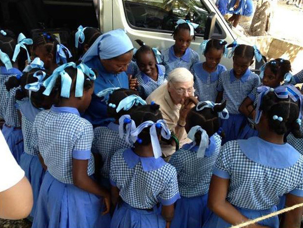 Dr. Emil T. Hofman greets the students of St. Rose of Lima School in Leogane, Haiti