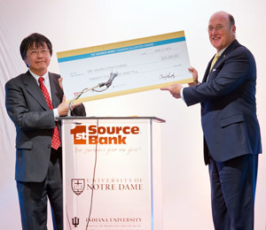 College of Engineering professor Hsueh-Chia Chang receives a ceremonial check from Chris Murphy, Chairman and CEO of 1st Source Bank after winning the 2013 1st Source Bank Commercialization Award